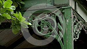 A wrought iron metalworks bracket ornamentation