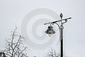 Wrought iron street light with artistic forging beautiful decorative vintage.