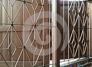 wrought iron window in old fashion style of two wooden windows of Asian house