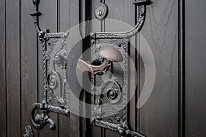 Wrought metal door handle closeup - church entrance