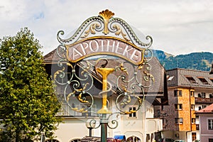 Wrought metal ornamental pharmacy street sign in Austria