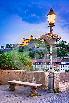 Wurzburg, Germany. Alte Mainbrucke and Marienberg Fortress, twilight photo