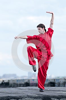 Wushoo man in red practice martial art