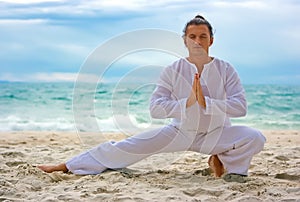 Wushu man on the beach