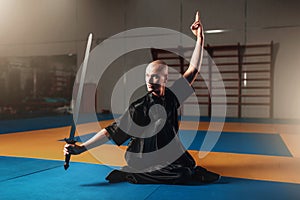 Wushu master training with sword, martial arts