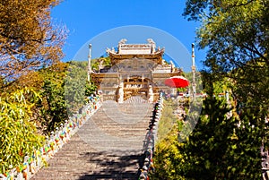 Wutaishan(Mount Wutai) scene-Carved stone torii in front of the Longquan temple door. photo