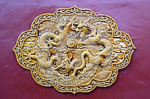 Wutaishan, Shanxi Province in China. Decorative tiles with dragons on a wall at Pusading Monastery