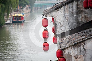 Wuxi old town, Jiangsu Province. Chinese lanterns hang from an ancient building along the Grand Canal - China