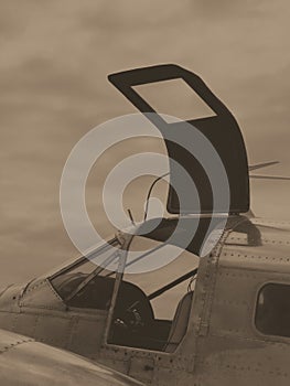 WW2 vintage airplane with open cockpit door BW