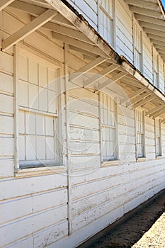 WWII era white-painted wooden military Barracks