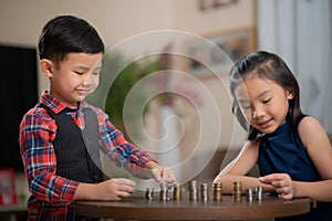 Asian children, managing finances, counting money photo