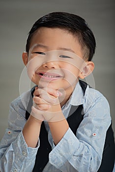 Asian boy, looking smart and intellectual, dressed sharp