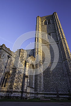Wymondham abbey. Impressive Norman church against blue sky.