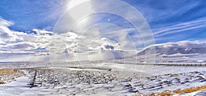 Wyoming countryside panoramic views during a blizzard with mountain with snow covered with overcast grey cloudy sky