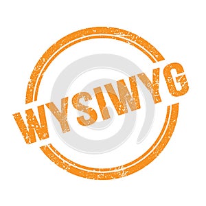 WYSIWYG text written on orange grungy round stamp