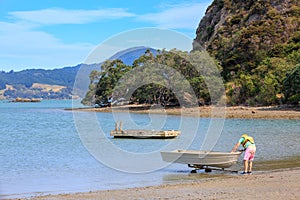 Launching a boat at Wyuna Bay on the Coromandel Peninsula, New Zealand photo