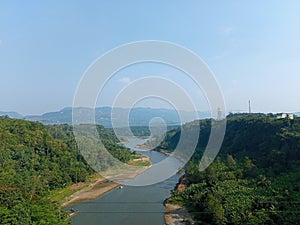 The beauty of the Citarum River surrounded by hills photo