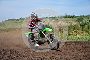 X games MX rider on a motorcycle in a bend photo