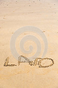 'Lato' word written on sand photo