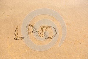 'Lato' word written on sand photo