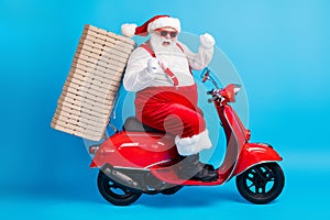 X-mas christmas tradition win full length profile side photo of white grey bearded hair santa claus drive scooter