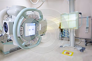 X-ray generator tube with monitor  or X-ray general device with Bucky stand in radiology .modern medical equipment in the hospital