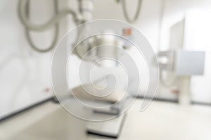 X-ray room blur background of empty radiological imaging scan equipment laboratory in blurry medical clinic or general hospital