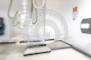 X-ray room blur background of empty radiological imaging scan equipment laboratory in blurry medical clinic or general hospital photo