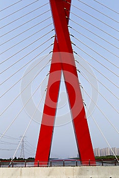 X in the shape of a cable-stayed bridge