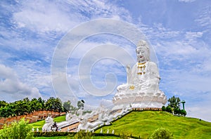 & x22;Huay Pla Kang Temple& x22; - The Big White Guanyin stands amid the white cloud and blue sky in the afternoon a