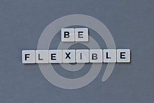 & x27; Be Flexible & x27; word made of square letter word on grey background