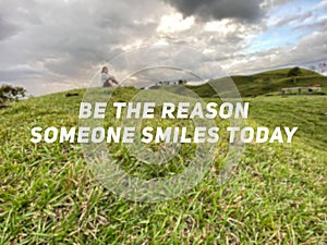 & x27;Be the reason someone smiles today& x27; text background. Inspirational quote concept.