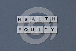 ' Health Equity ' word made of square letter word on grey background