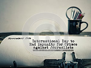 'International Day to End Impunity for Crimes against Journalists' text background. Awareness concept.