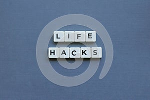 ' Life Hacks ' word made of square letter word on grey background