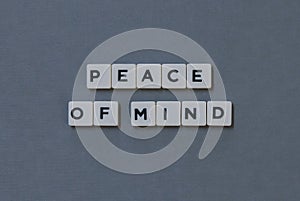 & x27; Peace Of Mind & x27; word made of square letter word on grey background