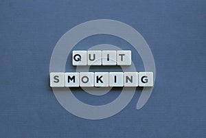 & x27; Quit Smoking & x27; word made of square letter word on grey background