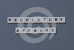 ' Regulatory Affairs ' word made of square letter word on grey background