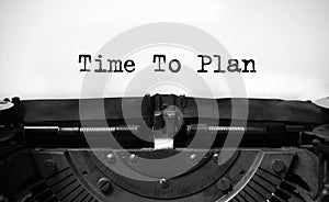'time to plan' typed words on a vintage typewriter. . Business concept
