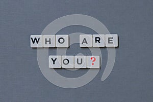 ' Who Are You? ' word made of square letter word on grey background