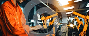 XAI Engineer use advanced robotic software to control industry robot arm in factory