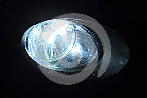 The xenon lamp in car\'s headlight glows
