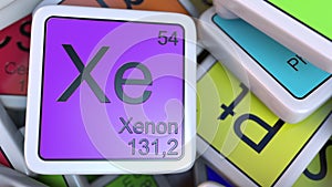 Xenon Xe block on the pile of periodic table of the chemical elements blocks. Chemistry related 3D rendering