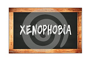 XENOPHOBIA text written on wooden frame school blackboard