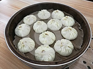 Xiao long bao on bamboo basket, dumpling with soup, local traditional Chinese food