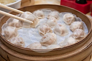 Xiao long bao soup dumpling buns with chopsticks in restaurant Traditional Chinese food in Taipei Taiwan