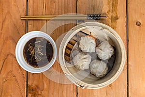 Xiaolongbao, a type of small Chinese steamed bun oe baozi traditionally prepared in a xiaolong, a small bamboo steaming basket