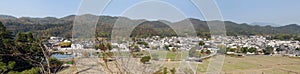 Xidi Ancient Town in Anhui Province, China. Wide panorama looking over fields to the old town