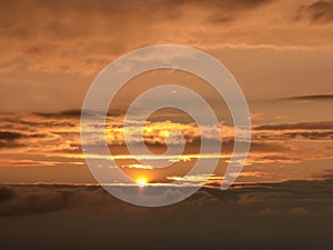 Xilinhot - Colofrul sunrise seen from a small hill in the suburbs of Xilinhot, Inner Mongolia. The sky is painted in orange,