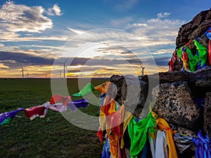Xilinhot - Heap of stones Aobao build on a vast pasture in Xilinhot in Inner Mongolia. The heap has colorful prayer flags